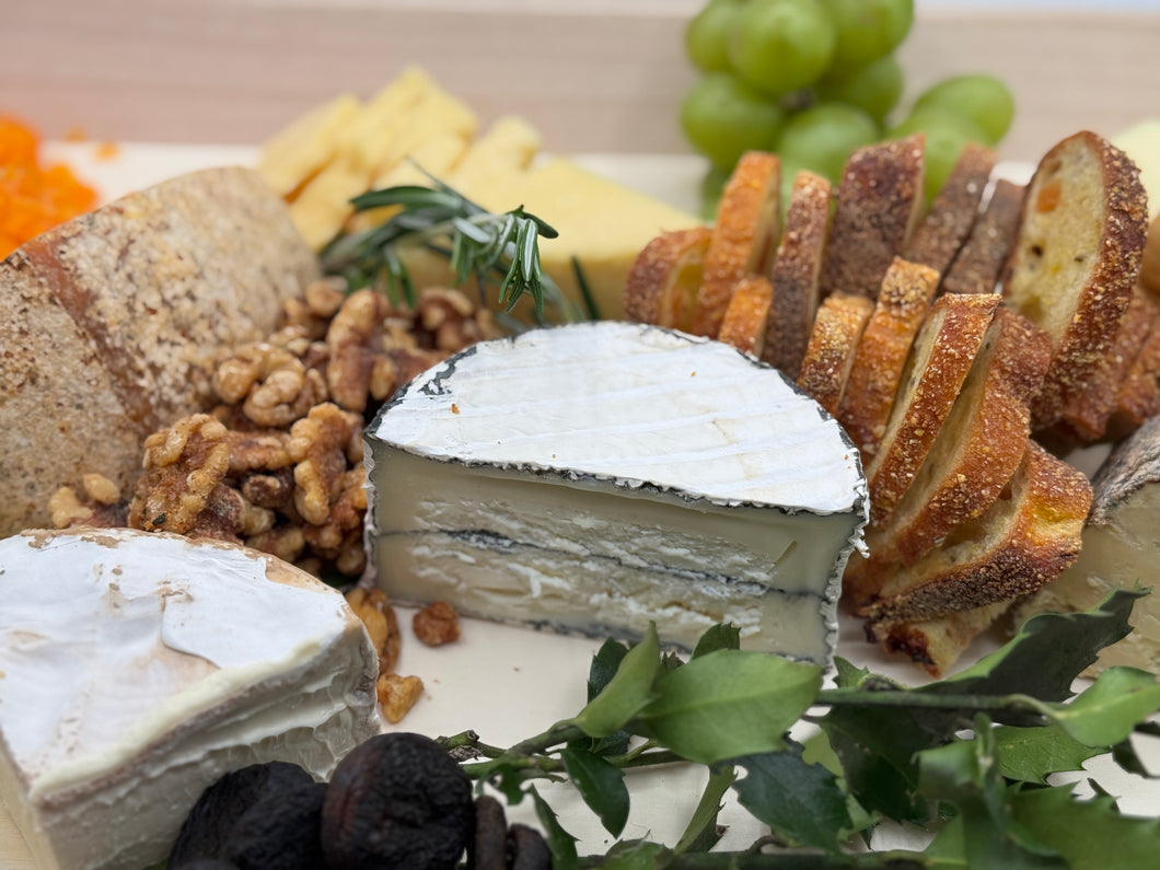 Cheeses · Local Artisan, Imported & American Cheeses - Garnished with Dried + Fresh Fruit, Homemade Chutney + Crackers (Serves 6-8)