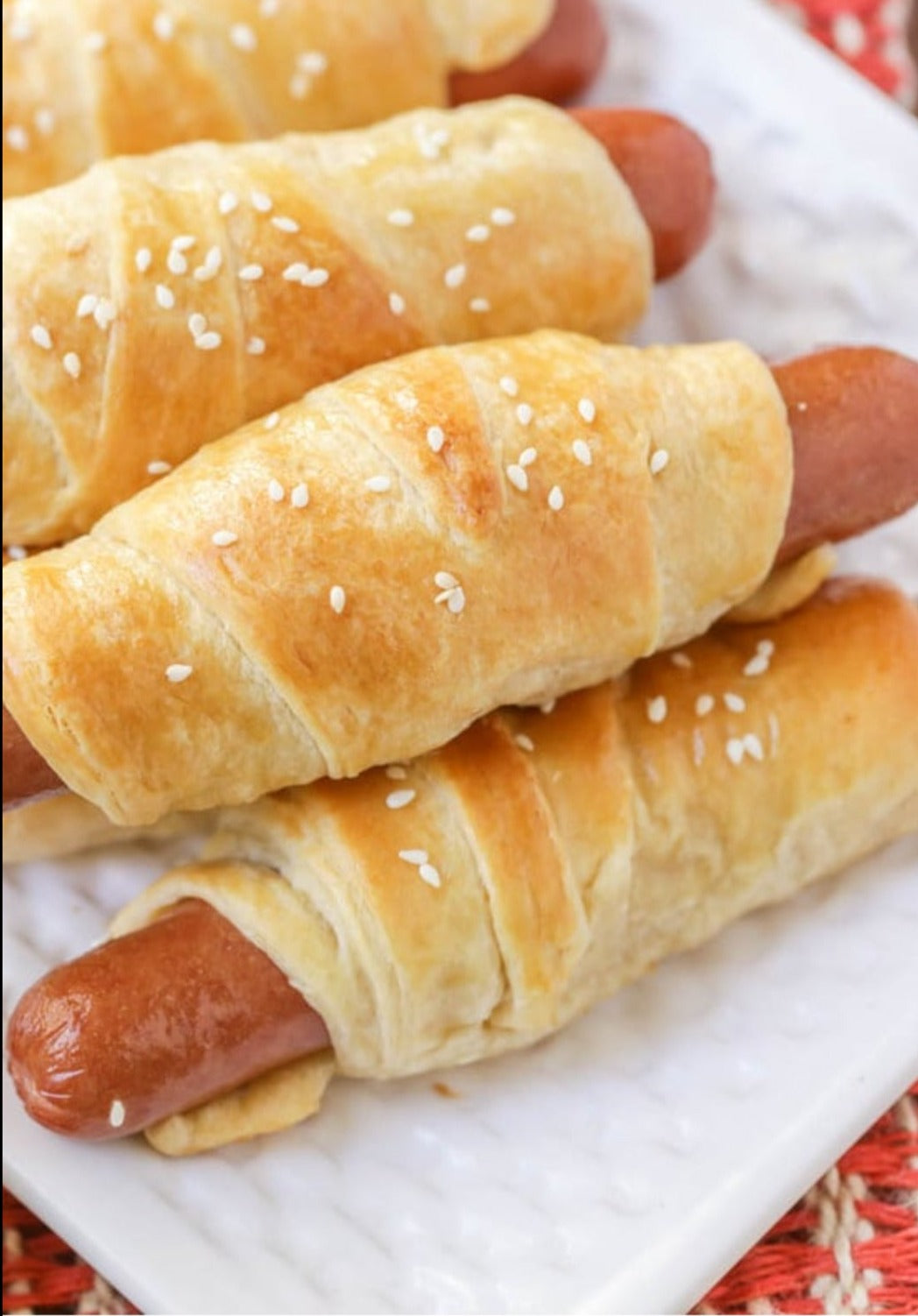 Pigs in a Blanket · Mini Hotdogs Rolled in Buttery Puff Pastry • Horseradish Mustard (2 -  8 piece rolls)