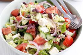 Chop Chop Greek Salad - Crisp Lettuces, Cucumbers, Tomato, Olives, Red Onion, Bulgarian Feta & Fava Beans- Served with Pita