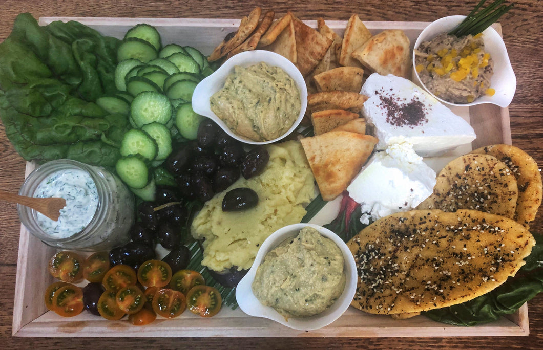 Mezze Platter ·  Tzatziki, Skordalia, Creamy Basil Hummus, Cucumbers, Marinated Olives, Cherry Tomatoes, Feta with Olive Oil & Sumac  - Pita  (serves 6-8)