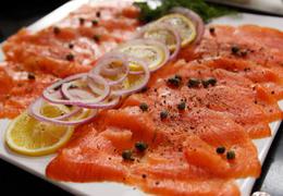 Thinly Hand Sliced Smoked Salmon Platter • Chopped Red Onion, Lemon, Capers, Dill Sauce & Brown Bread.